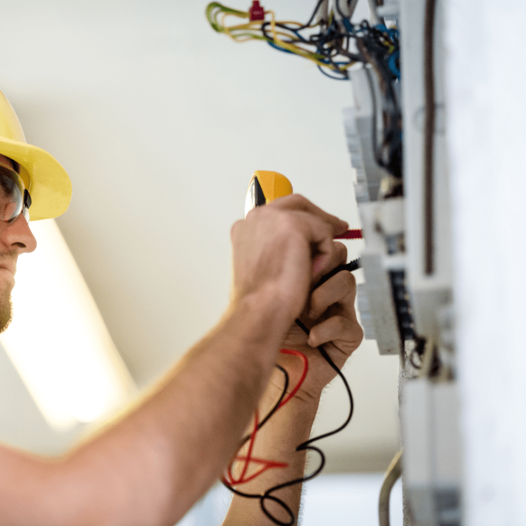 Electrician testing a connection for phones