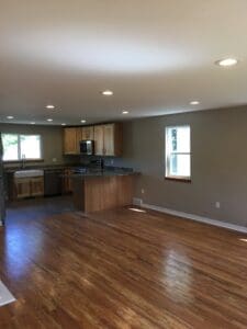recessed lighting in living room and kitchen of home