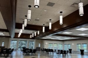 Hanging cathedral lights over dining area