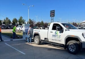 Swiftec workers installing an EV charging station